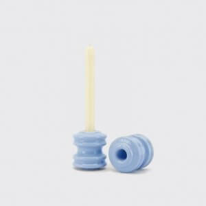 blue candleholder in the form of two skate wheels