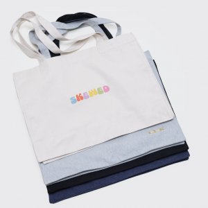 shopping bag faded logo in organic cotton - rainbow coloured skewed logo