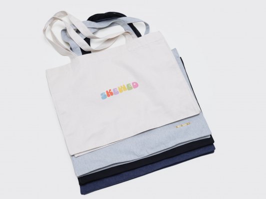 shopping bag faded logo in organic cotton - rainbow coloured skewed logo